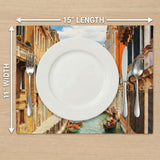 Placemat with scenic design of a canal and buildings, featuring cutlery for size reference.